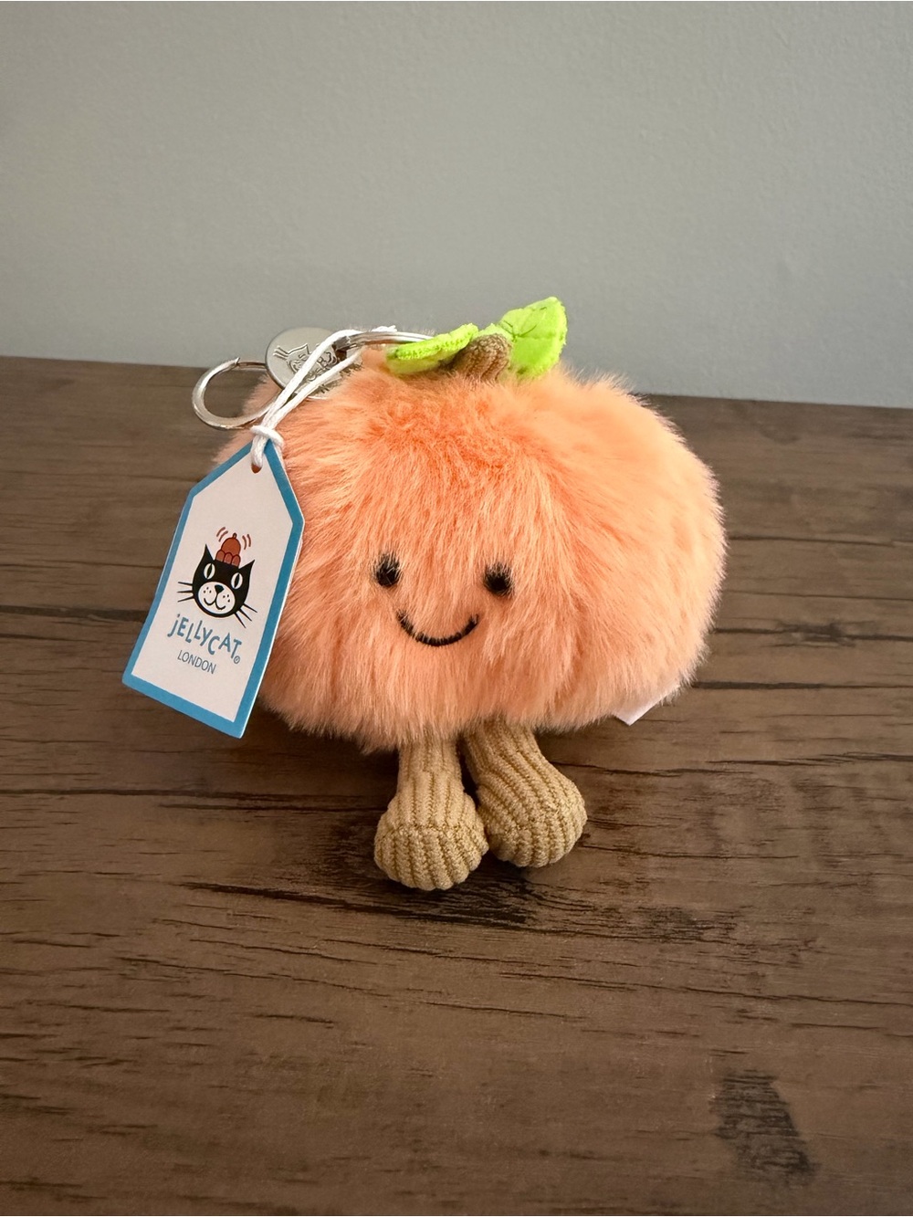 Jellycat Peach Plush Keyring in Soft Orange with Green Leaf